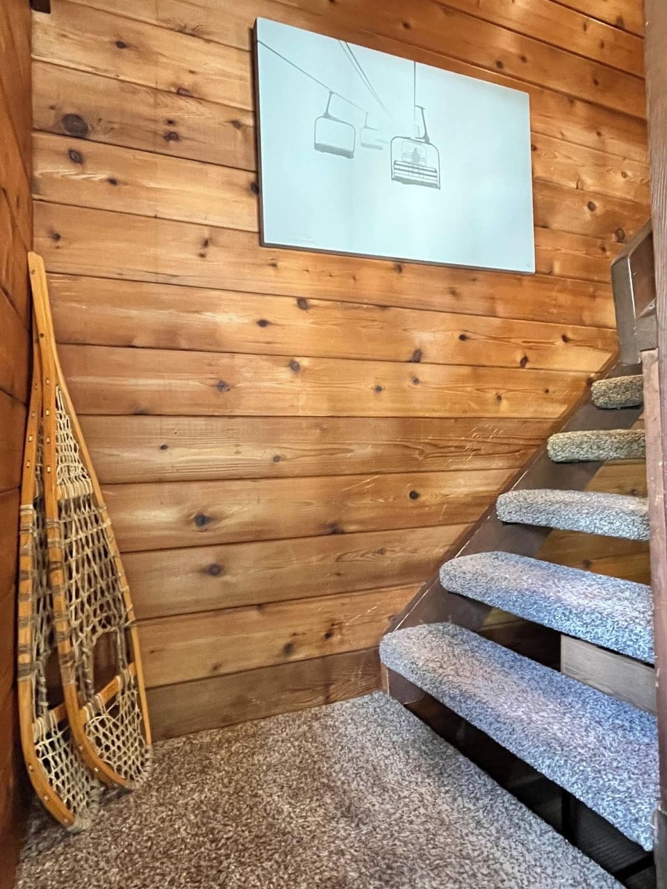 First landing of the staircase leading to the upstairs king bedrooms. 