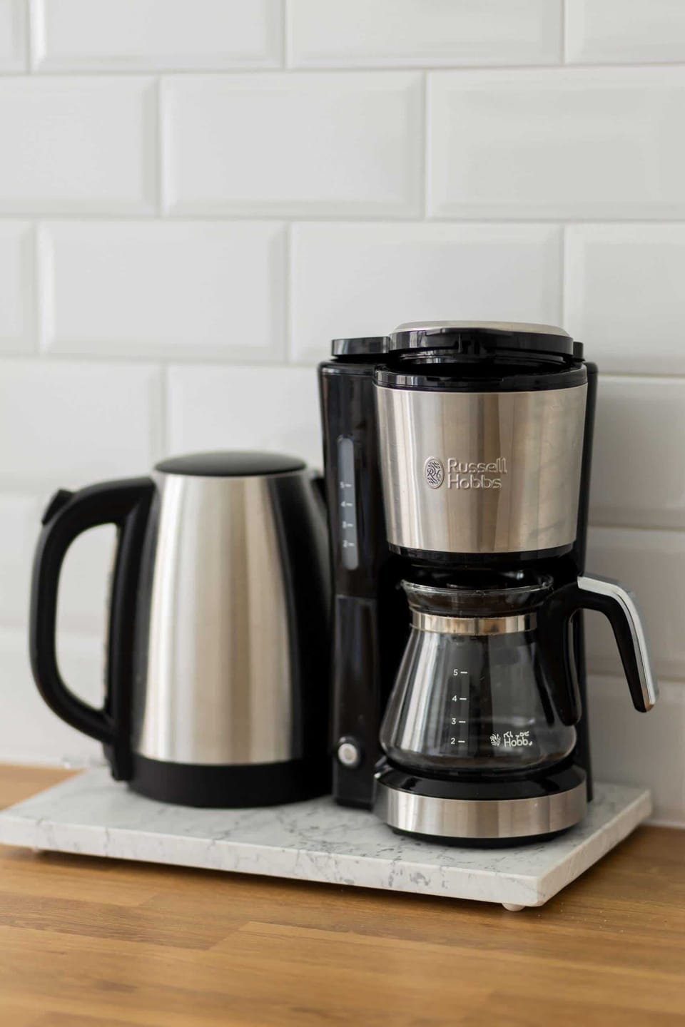 Kettle and coffee maker in the kitchen.