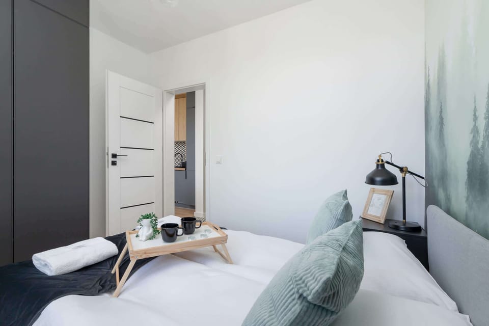 The bedroom's tasteful decor combines functionality with elegance. 