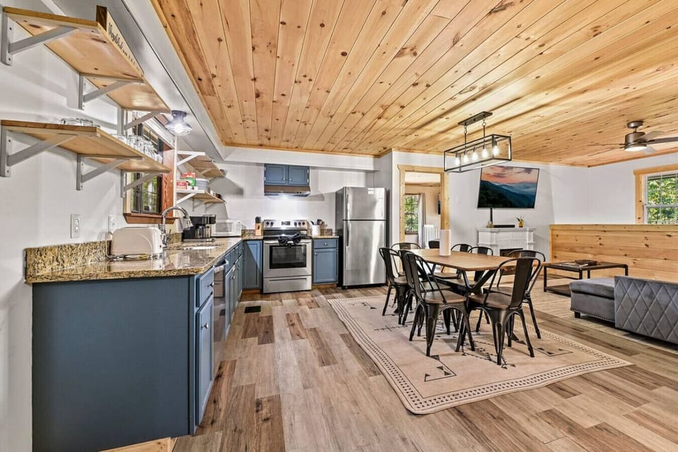 Open floorplan with dining area and kitchen conveniently located in the same space.
