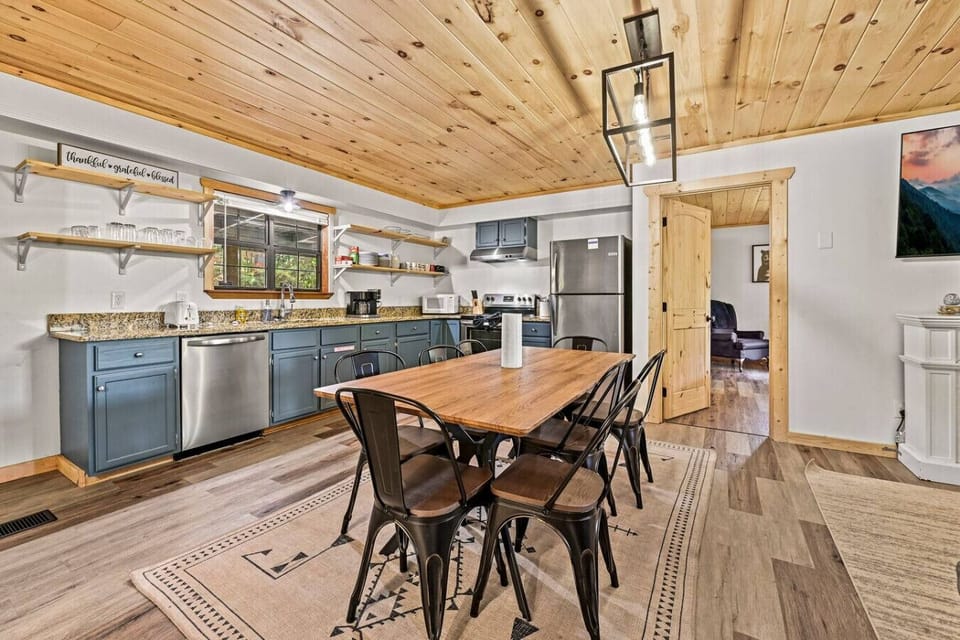 The kitchen comes fully equipped with a suite of stainless steel appliances.