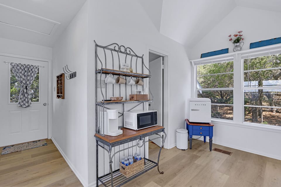 The room has a coffee bar and microfridge. This is the view looking from the bed toward the entrance to the ensuite bathroom.