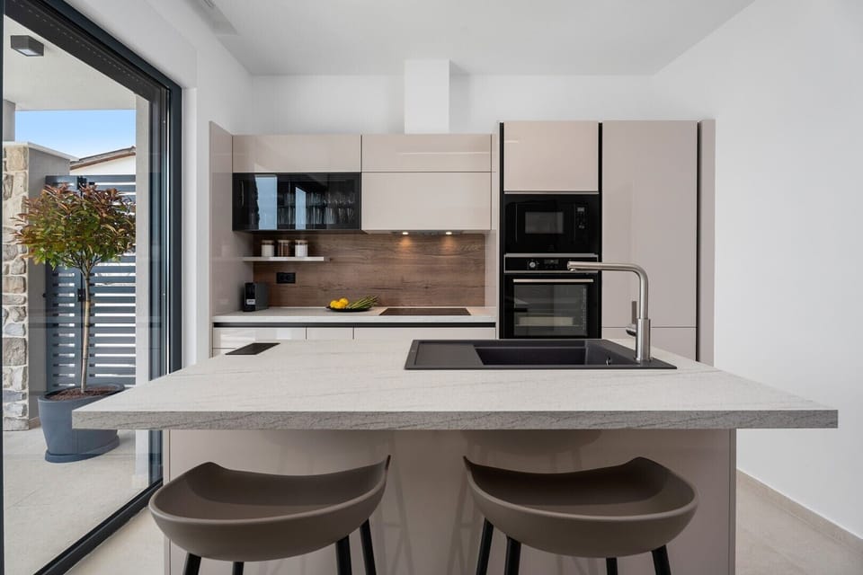 The kitchen island has all the amenities a modern guest needs.
