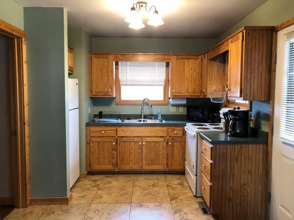 Fully stocked kitchen with views to the large yard and patio