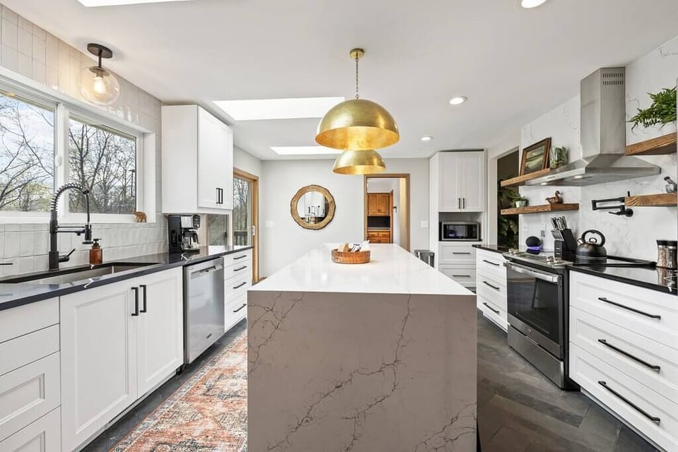 This beautiful kitchen is fully stocked w/ everything you need to cook meals for your whole family. In the morning, brew some provided coffee using the Ninja, Keurig or French Press.

3 Skylights for ample light & large windows to take in lake views!