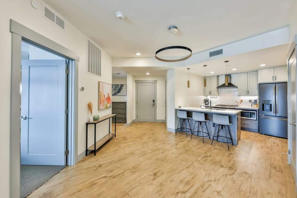 Step into a seamless open kitchen featuring premium finishes and inviting contemporary style.