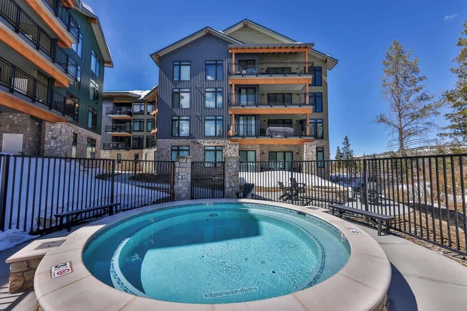 2. Indulge in a relaxing outdoor hot tub experience surrounded by breathtaking alpine scenery.