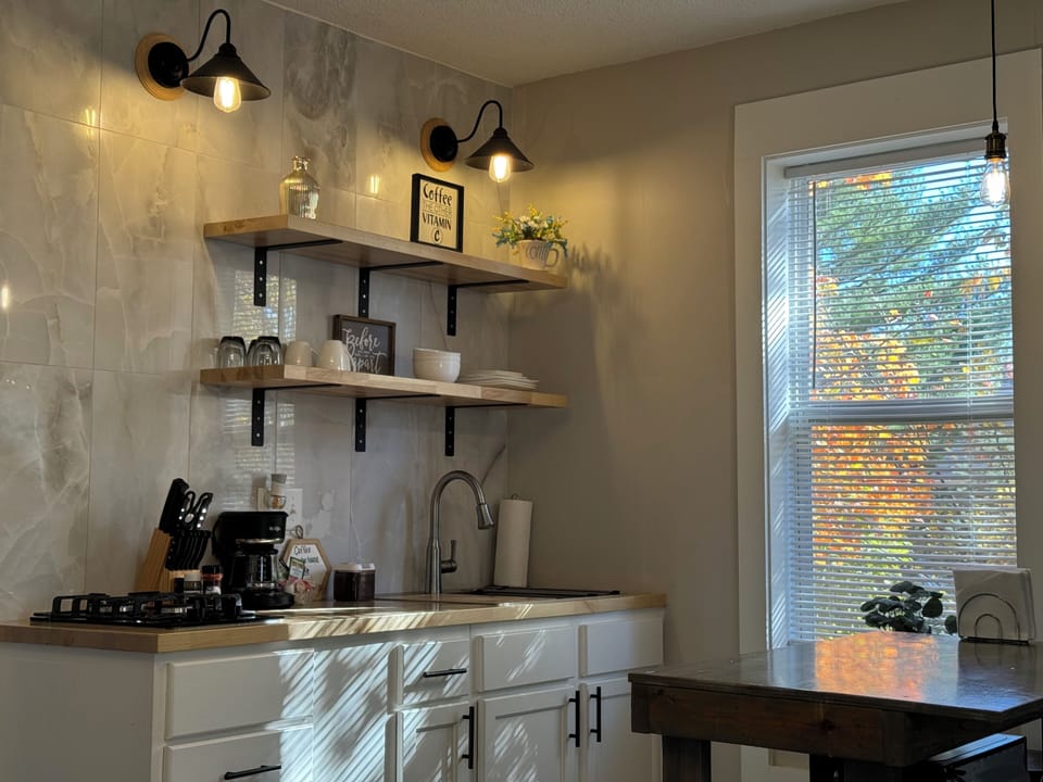 Kitchen with microwave, rice cooker, toaster, and other needed cooking wear