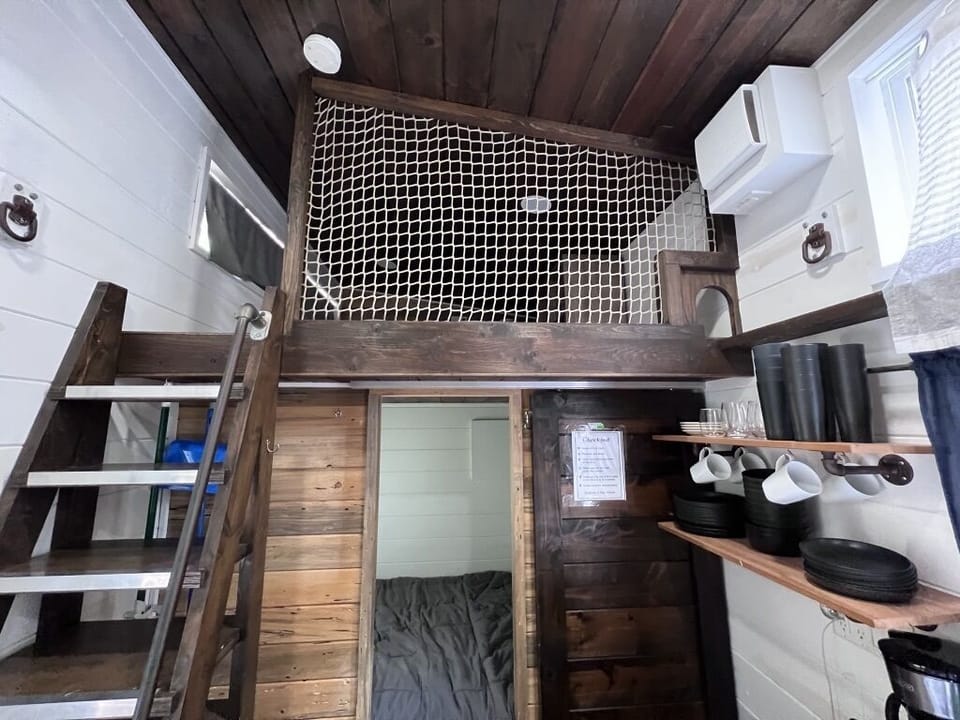 Sliding door to queen bed room, stairs to 1 of 2 lofts with double beds