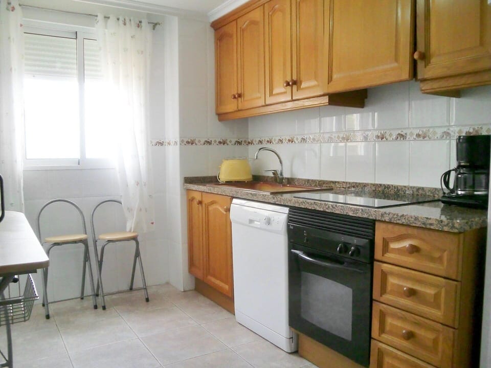 Countertop, Cabinetry, Property, Furniture, Room, Kitchen, Kitchen Stove, Floor, Interior Design, Building