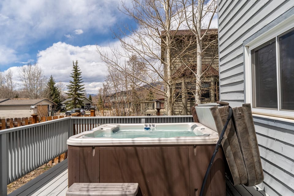 Soak in your private hot tub while enjoying mountain views and crisp fresh air from your deck.