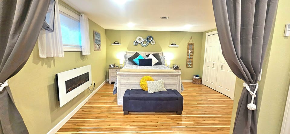 Spacious bedroom with a very comfortable Queen memory foam mattress, electric fireplaces, and plenty of closet space. 