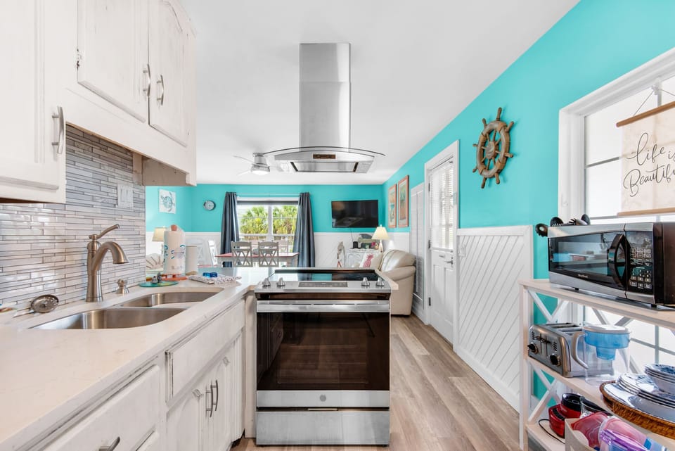 Kitchen with oven and vent hood