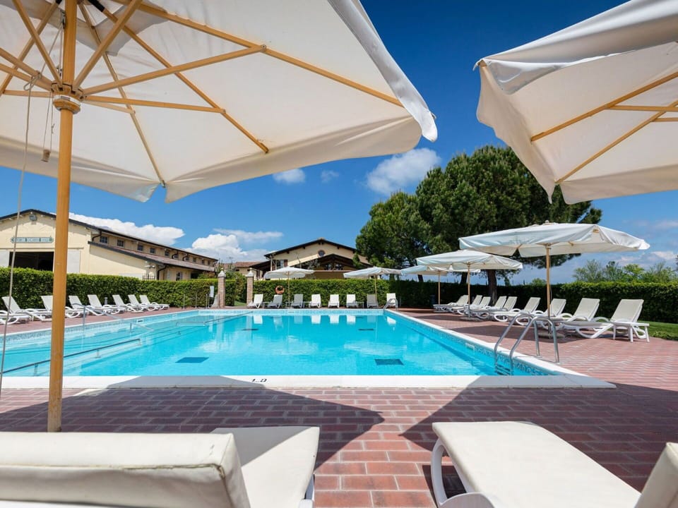 Water, Sky, Plant, Property, Swimming Pool, Azure, Shade, Outdoor Furniture, Sunlounger, Tree