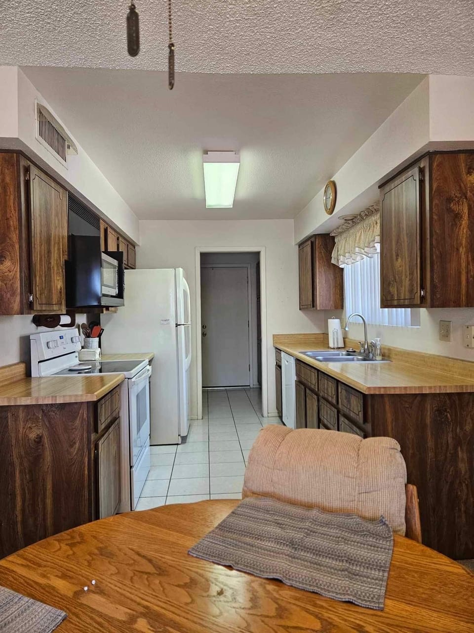 Kitchen is roomy with a dishwasher
