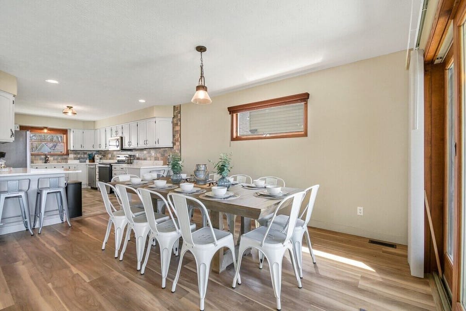 Open dining room with seating for 14 and direct access to the patio with grill!