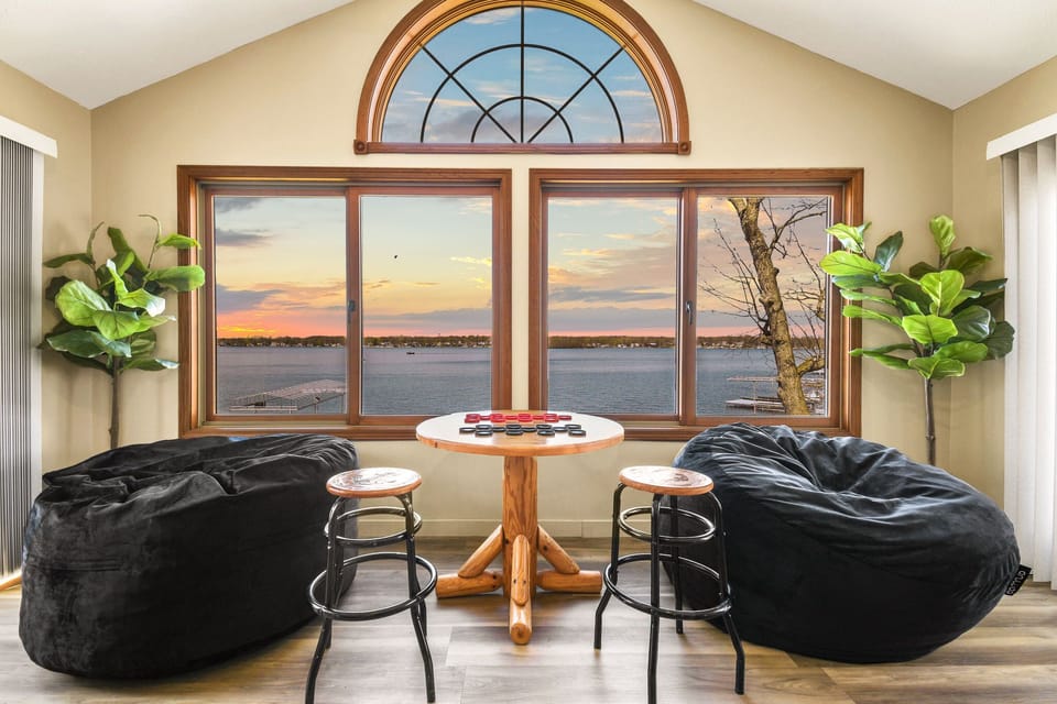 Upstairs game room with plenty of room to relax with family and friends and a lakefront view!