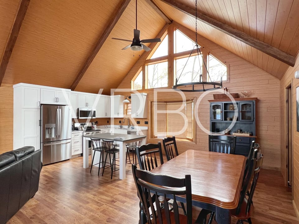 Looking back at kitchen and dining space from entry hallway/guest bedroom.