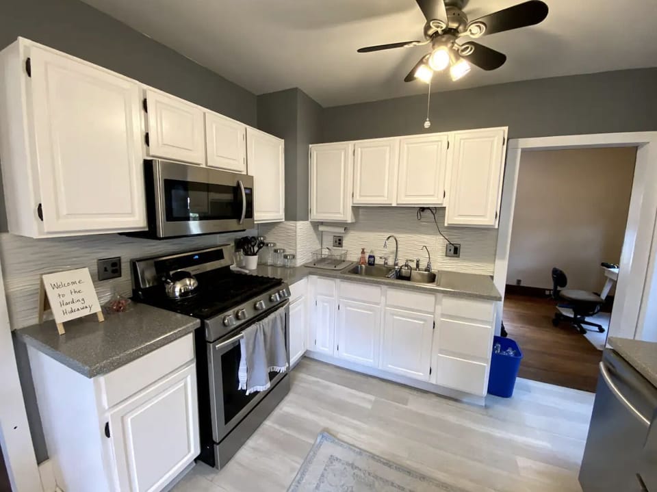 Spacious kitchen with stainless steel appliances.