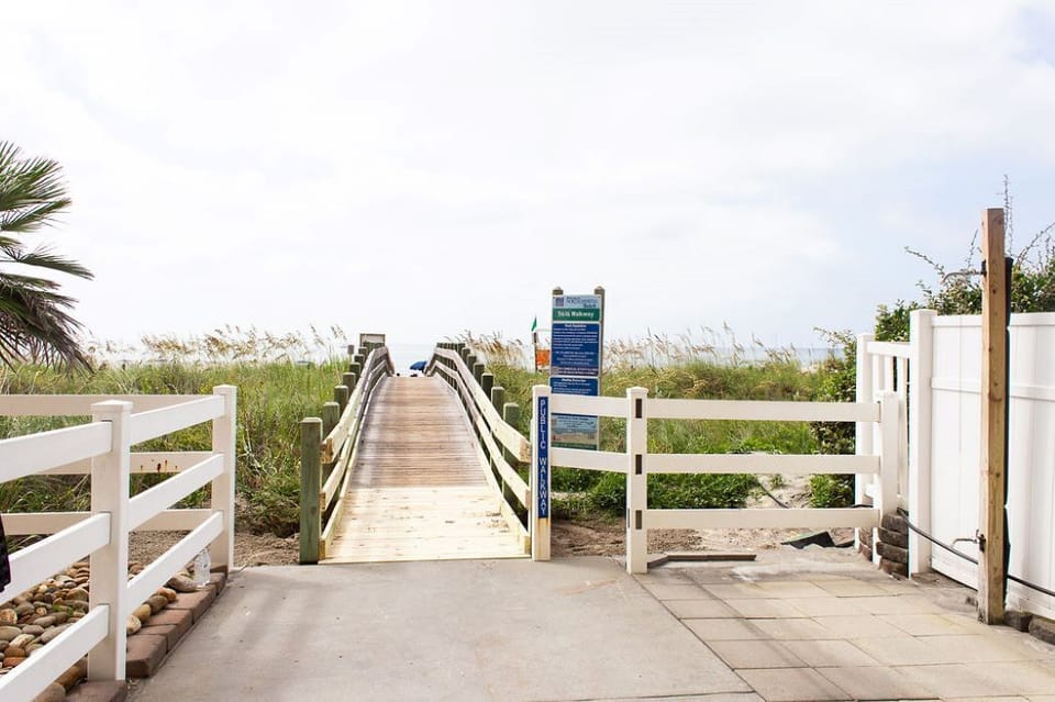 Boardwalk to Beach with Outdoor Shower and Foot Rinse.