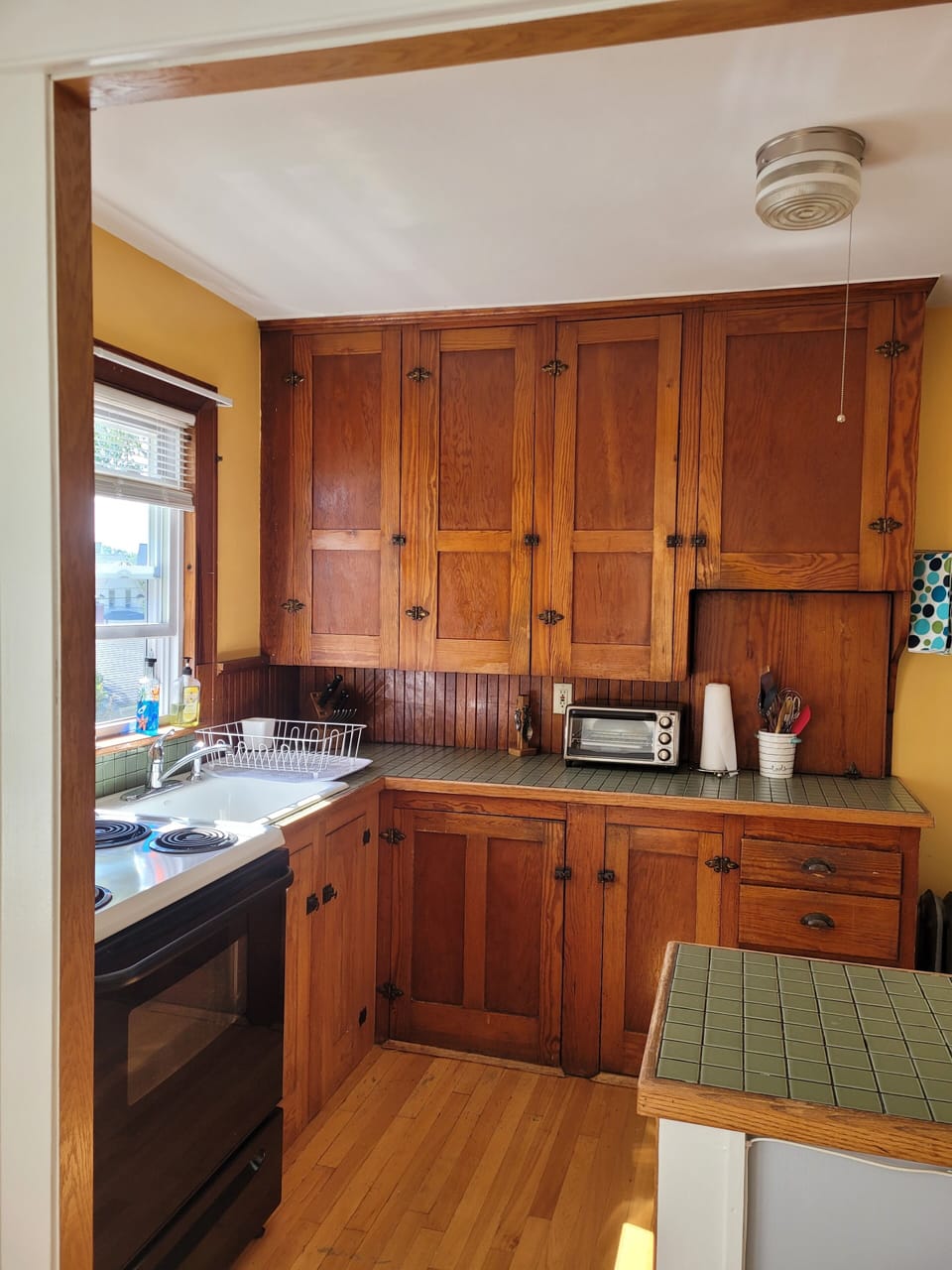 Kitchen with original douglas fir cabinets.