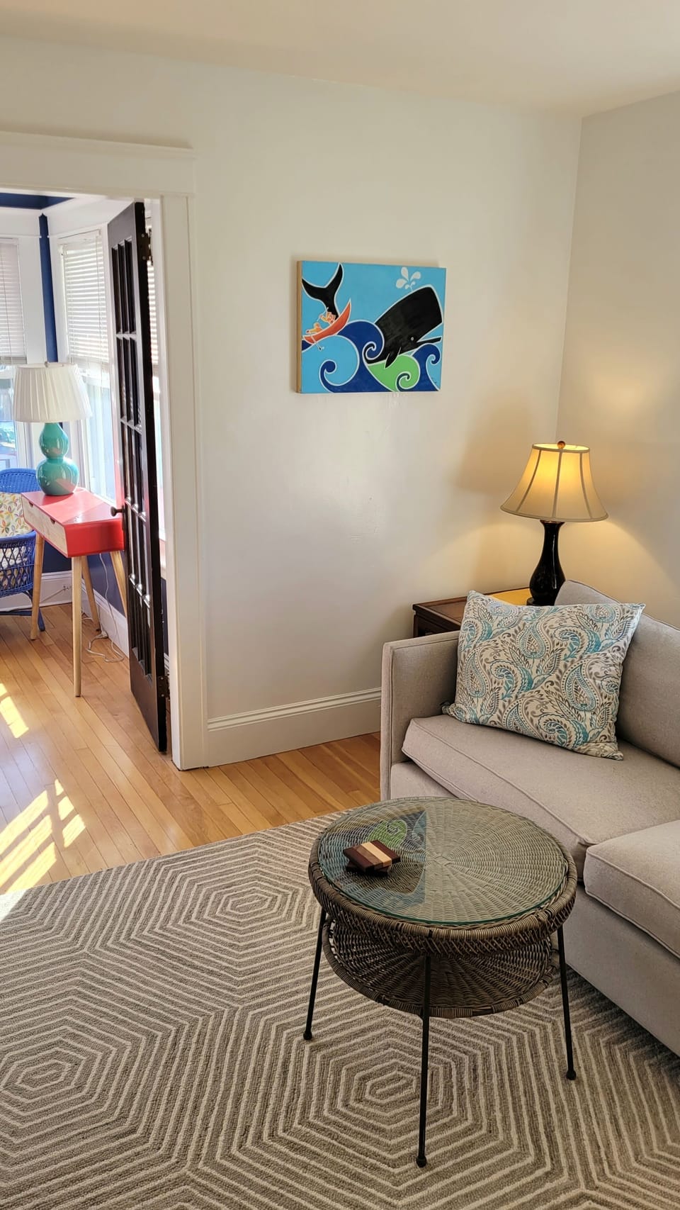 From the living room to the sunroom with original painting by Marie Ahern.