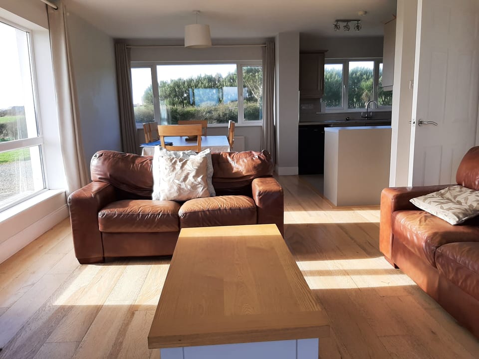 Open Plan Lounge with 2 seater and 3 seater leather couches