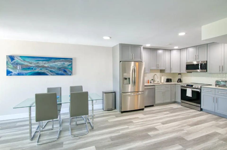 Sleek kitchen and dining area with plenty of space to gather.