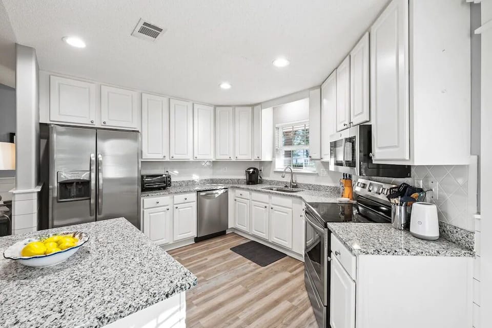 Bright open, fully stocked kitchen 
