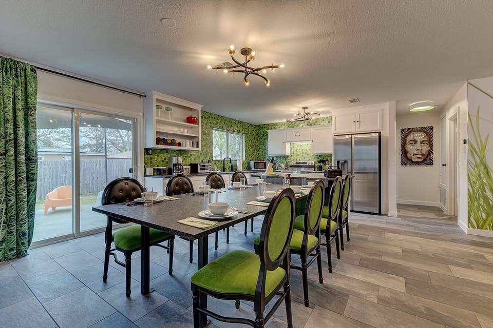 Dining table is attached to kitchen Island for easy hosting of meals