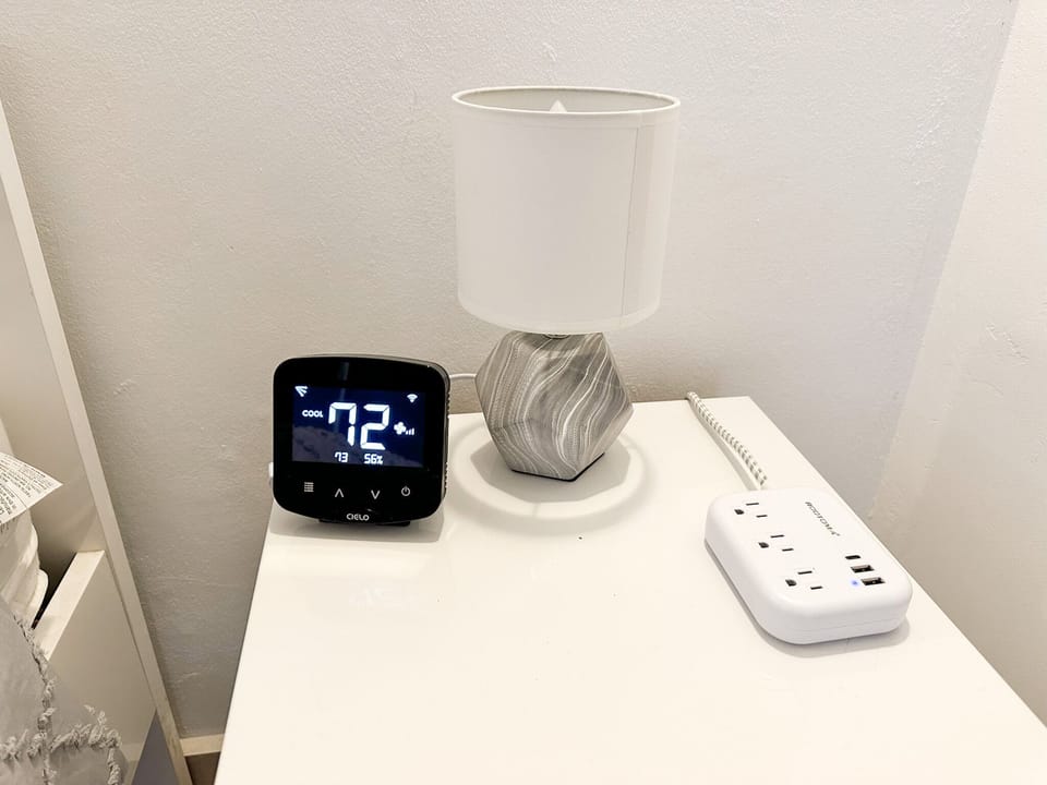 Each room is equipped with side tables, lamps, charging stations and thermostat.