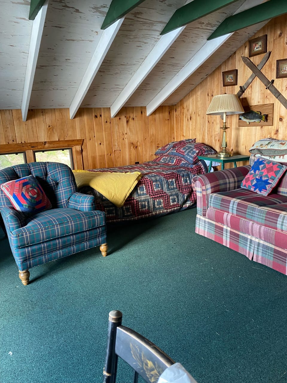Boathouse living area with twin bed