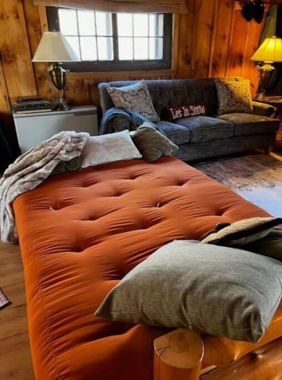The futon downstairs makes an extra sleeping space and is close to the stove! 