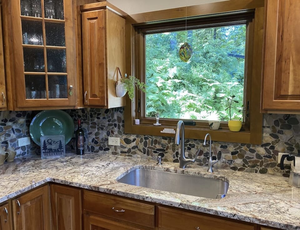 Large farm sink with a beautiful view