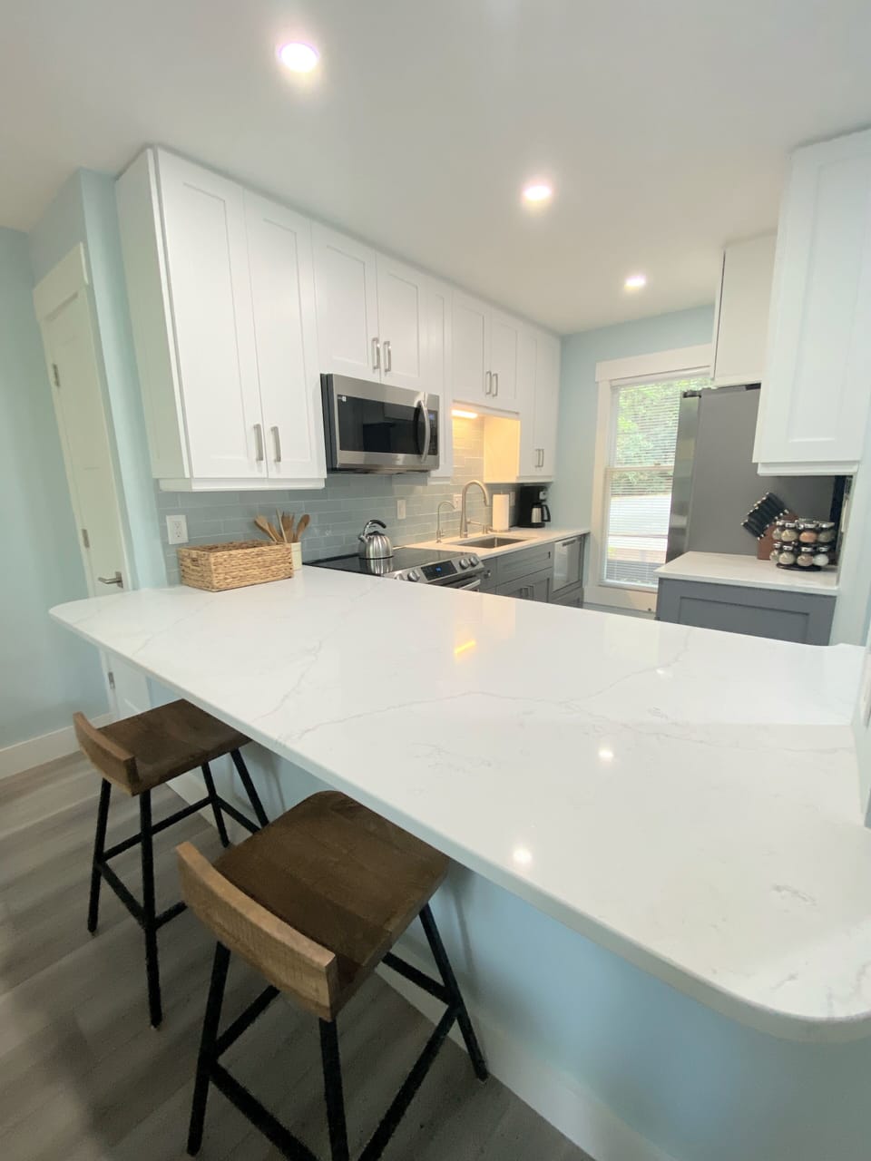 Fully updated kitchen with everything you need or want to prepare a meal while still spending time with family and friends. Bar seating for quick snacks