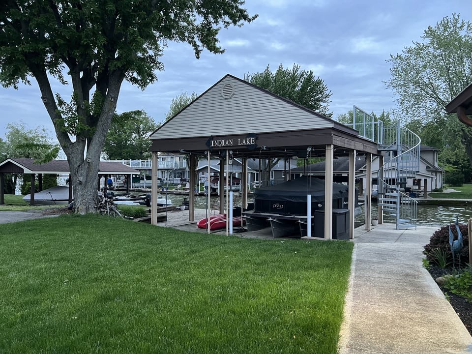 Grassy yard with two level private dock.