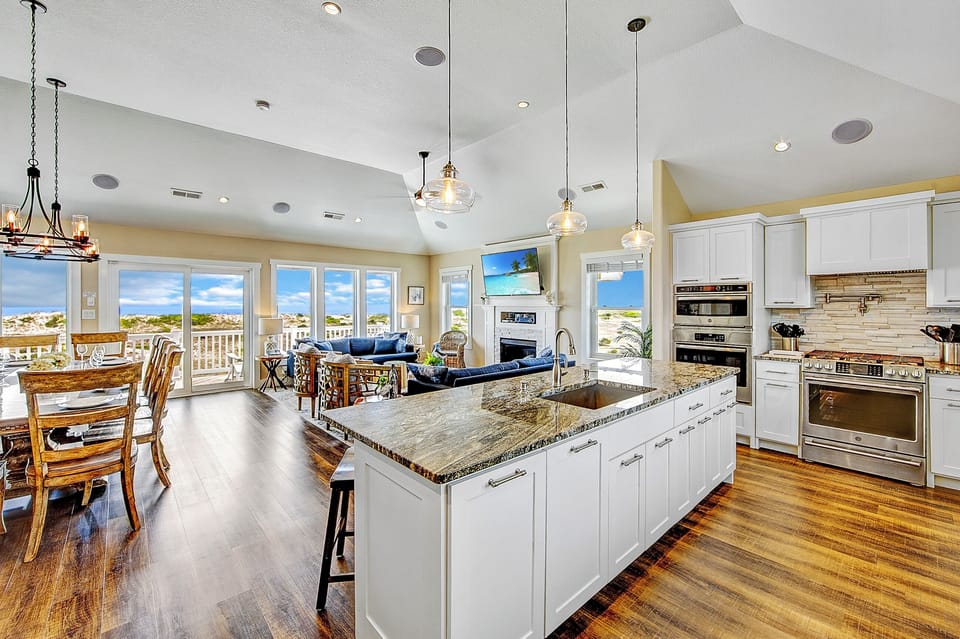 Our expansive kitchen island, complements the elegant great room