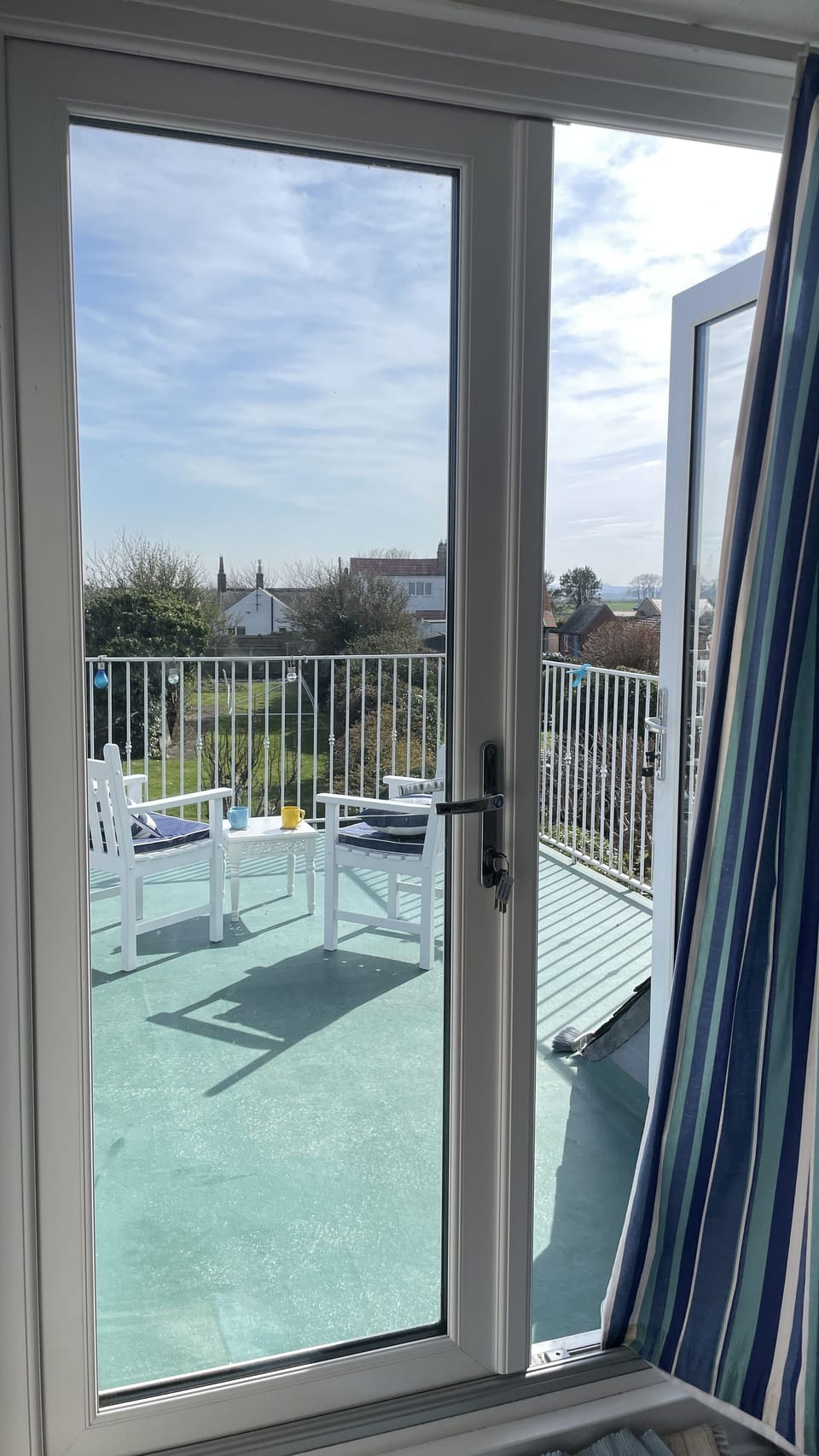 The French doors lead out from the master bedroom to the balcony 