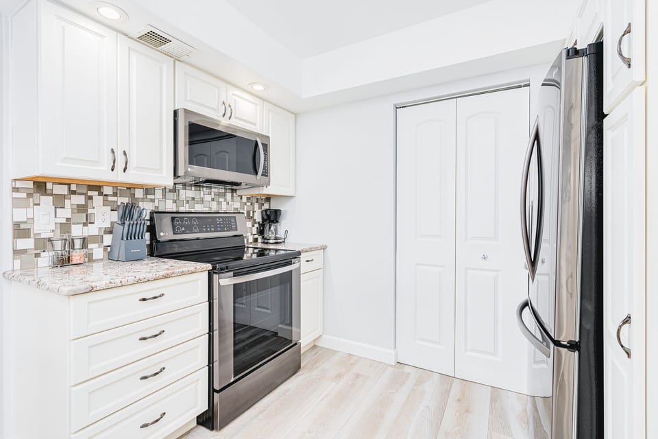 Private laundry room located just off the kitchen