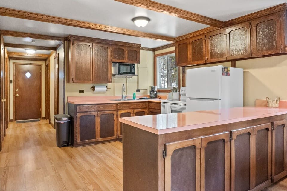 The kitchen has an open layout providing plenty of space for everyone to put together breakfast or all help out with dinner prep.