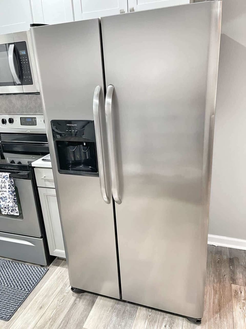 Full-size stainless refrigerator — plenty of space for family groceries.