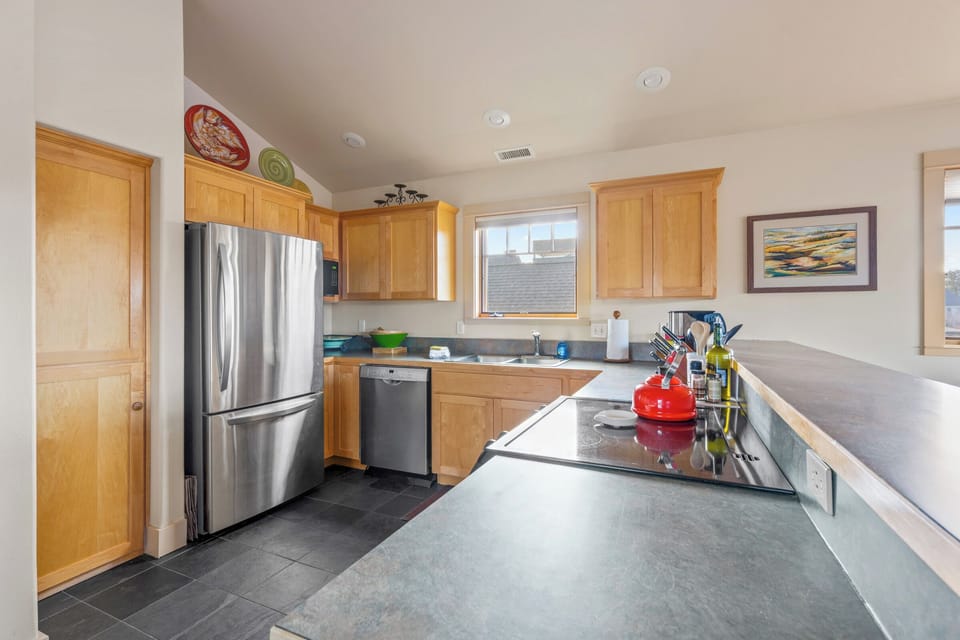 Your spacious kitchen features modern appliances, granite counters, and everything you need for memorable meal prep.