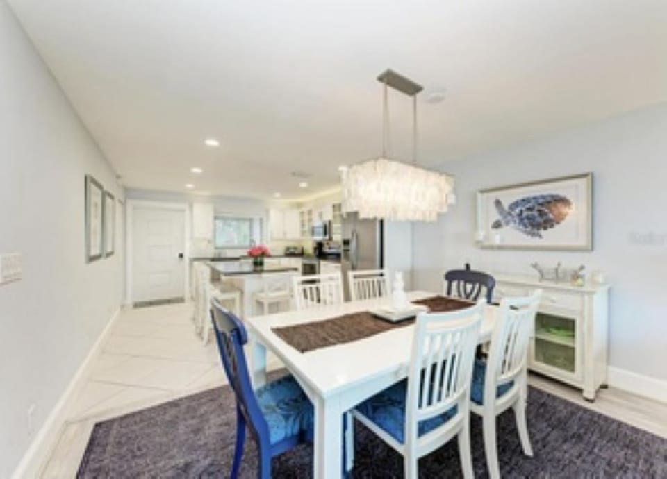 Bright & sunny dinning room with seating for 6 opens to the kitchen/living room