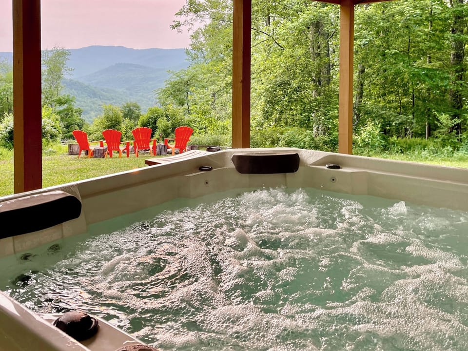 Private 6 person hot tub with stunning sunset and mountain views
