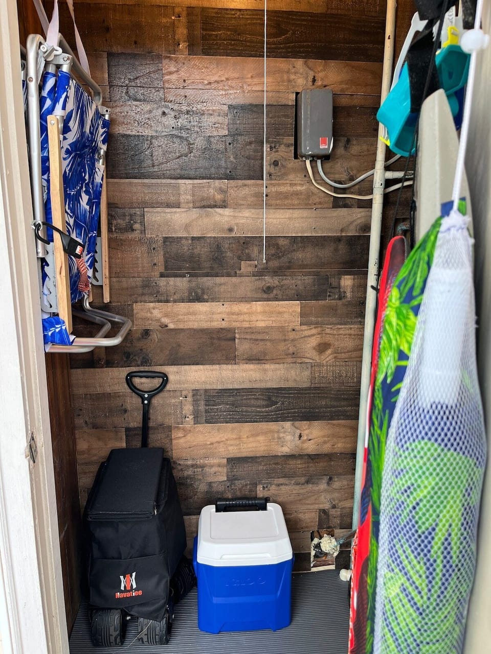 Beach closet includes water sports, umbrella, chairs, wagon,cooler, beach towels