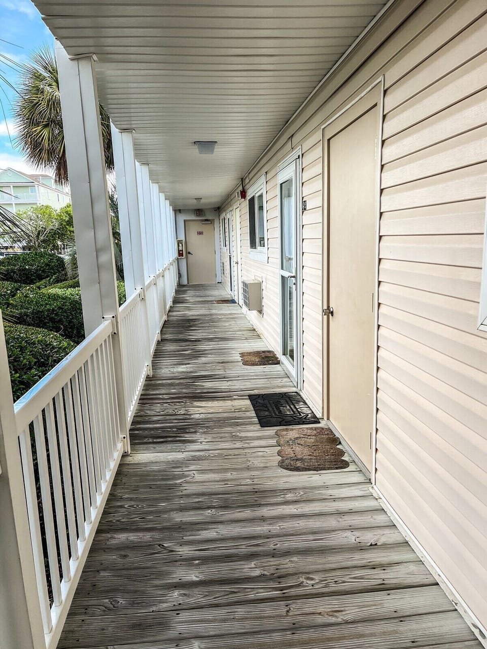 Clean and scenic main floor boardwalk porch on the way to Blue Palms condo!