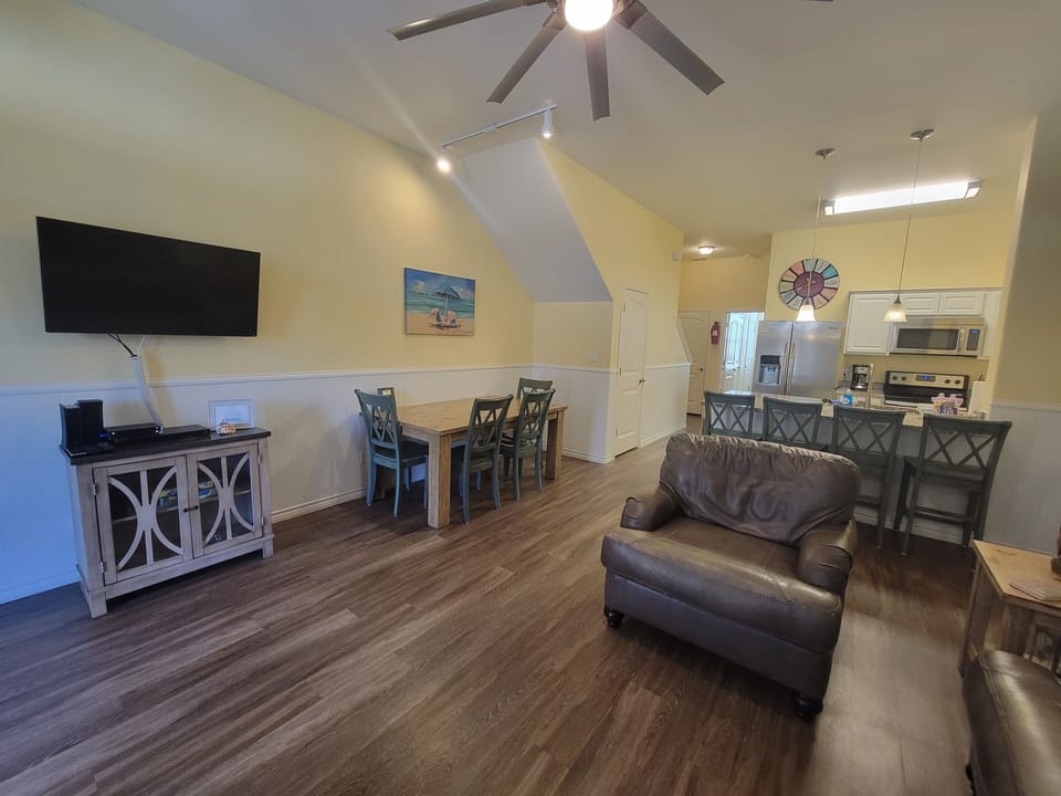 Living room, dining table and kitchen