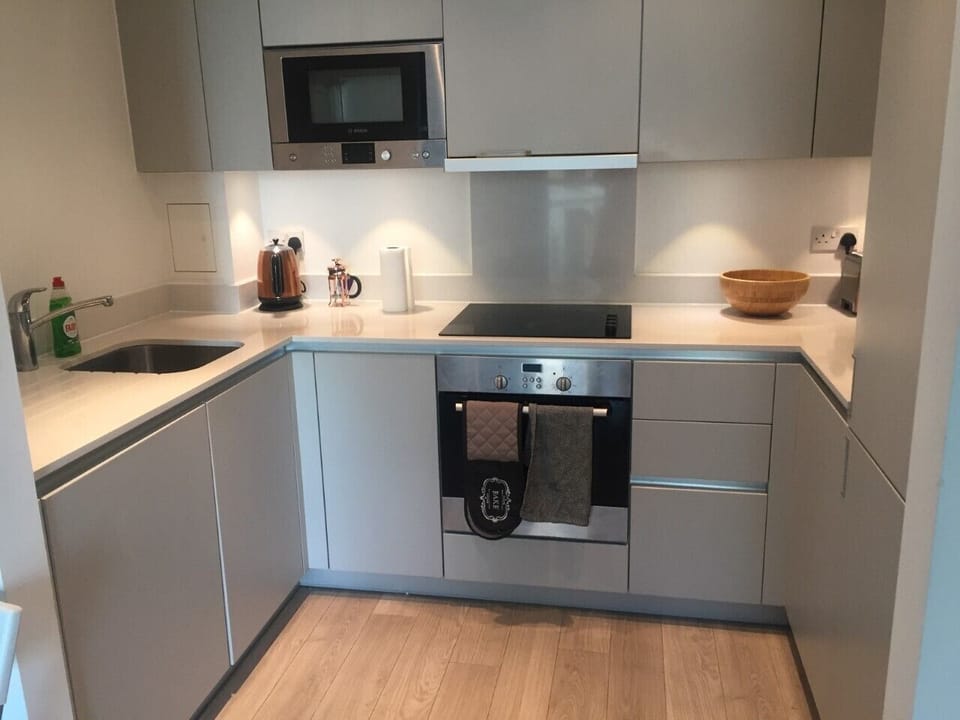 Kitchen with microwave, dishwasher, fridge freezer, cooker and oven.