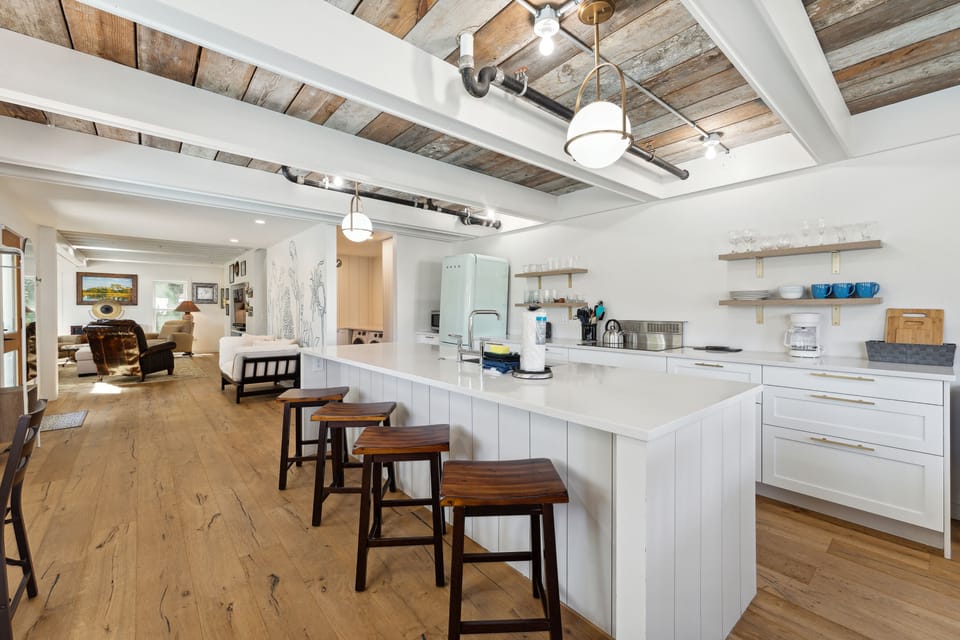 Open floor plan kitchen with island and breakfast bar seating.