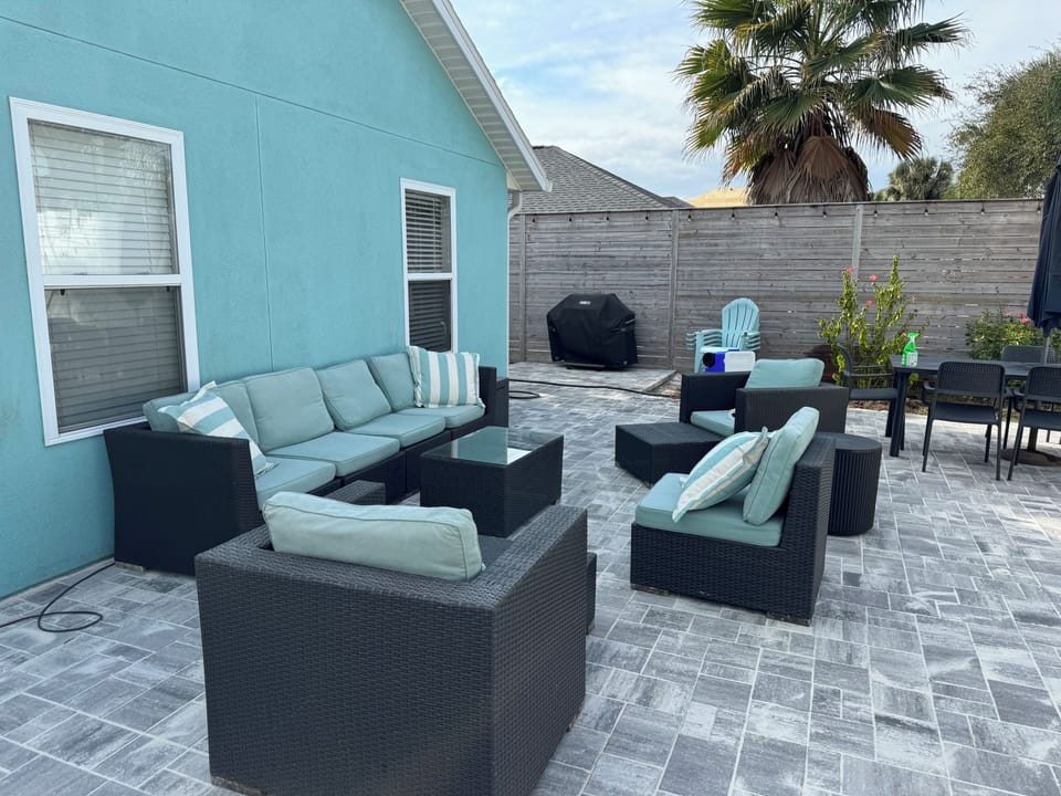 amazing new backyard patio with lots of seating and umbrellas for shade